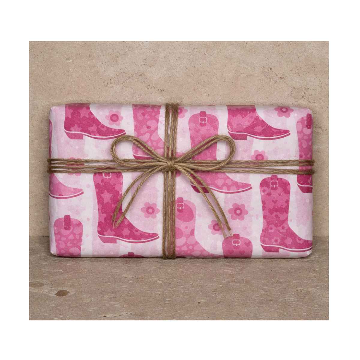 Clay & Colour Gift Wrap - Packaged product with pink cowboy boot pattern on a brown background
